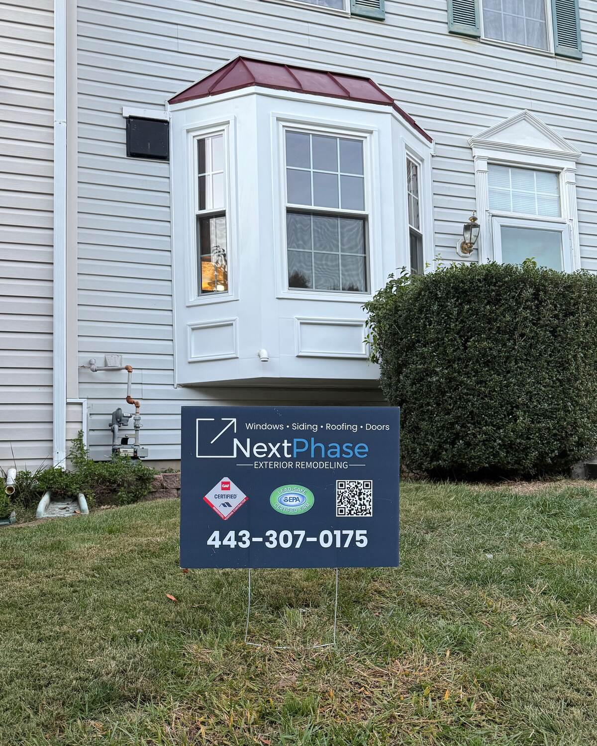 Vytex replacement windows and metal-capped walkout bay in Aberdeen, MD by Next Phase Exterior