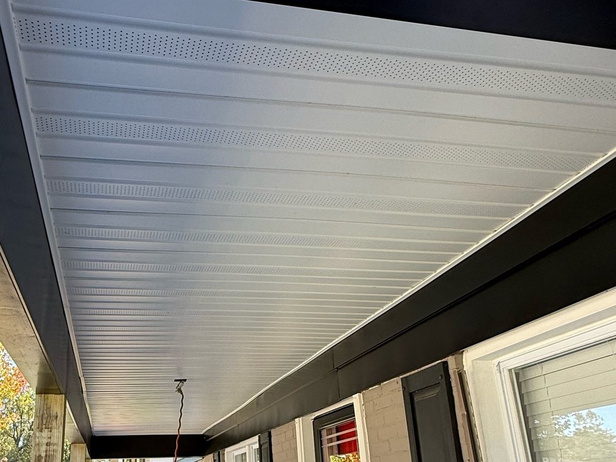 New white porch soffit and black G8 metal fascia on a Joppa, MD siding replacement