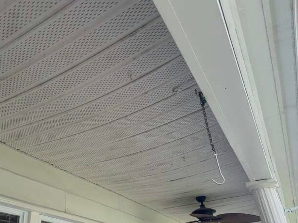 Front porch soffit before replacement on a Joppa, MD siding project